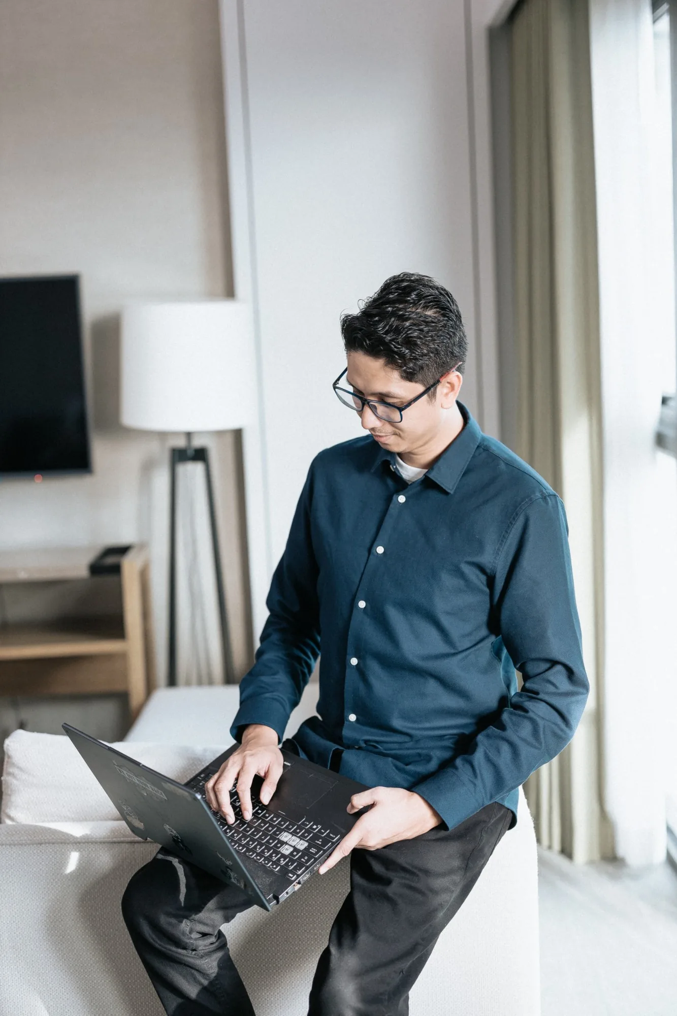 Maj Custodio building a client funnel on his laptop